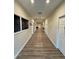 Clean and bright community hallway with access to various amenities at 12127 Luftburrow Ln, Hudson, FL 34669