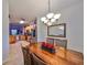 Dining room with wooden table and chairs, and a view of the kitchen at 12127 Luftburrow Ln, Hudson, FL 34669