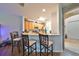 View of kitchen with breakfast bar and light wood cabinets at 12127 Luftburrow Ln, Hudson, FL 34669