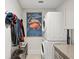 Laundry room with washer, dryer, coat rack, and storage at 146 4Th Ne Ave # 504, St Petersburg, FL 33701