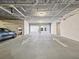 Two-car parking garage with ample space and ceiling-mounted lighting at 146 4Th Ne Ave # 504, St Petersburg, FL 33701