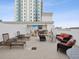 Relaxing rooftop terrace with lounge furniture and grill at 146 4Th Ne Ave # 504, St Petersburg, FL 33701