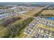 Aerial view of a residential neighborhood with houses and green spaces at 14690 Horse Trot Rd, Lithia, FL 33547