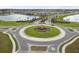 Aerial view of a residential community roundabout with lush landscaping at 14690 Horse Trot Rd, Lithia, FL 33547