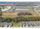 Aerial view showing a large residential area with various houses, roads, and green spaces at 14690 Horse Trot Rd, Lithia, FL 33547