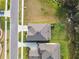 Aerial view showcasing a house with a gray roof in a residential neighborhood at 14690 Horse Trot Rd, Lithia, FL 33547