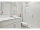 Bathroom with a white vanity, toilet and glass shower at 14690 Horse Trot Rd, Lithia, FL 33547