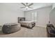 Bedroom with twin bed, ceiling fan, and window with shutters at 14690 Horse Trot Rd, Lithia, FL 33547