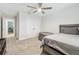 Bedroom with a full bed, ceiling fan, and double doors to closet at 14690 Horse Trot Rd, Lithia, FL 33547