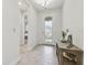 Entryway with tile floors and a rustic console table at 14690 Horse Trot Rd, Lithia, FL 33547