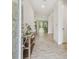 Bright and airy entryway with tile floors and a console table at 14690 Horse Trot Rd, Lithia, FL 33547