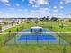 Two pickleball courts with a covered seating area at 14690 Horse Trot Rd, Lithia, FL 33547