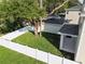 Backyard with large tree and white fence at 1740 W Saint Louis St, Tampa, FL 33607