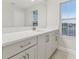 Bathroom with white cabinets and quartz countertop at 1740 W Saint Louis St, Tampa, FL 33607