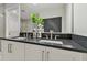 Modern bathroom with double vanity and dark countertop at 1740 W Saint Louis St, Tampa, FL 33607