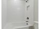 Clean bathroom with a white tub and shower at 1740 W Saint Louis St, Tampa, FL 33607