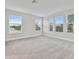 Spacious bedroom with neutral carpet and large windows at 1740 W Saint Louis St, Tampa, FL 33607