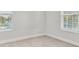 Spacious bedroom with two windows and neutral decor at 1740 W Saint Louis St, Tampa, FL 33607