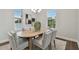 Dining room with hardwood floors, wooden table, and gray chairs at 1740 W Saint Louis St, Tampa, FL 33607