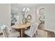 Dining room with hardwood floors, wooden table, and gray chairs at 1740 W Saint Louis St, Tampa, FL 33607