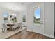 Dining room with hardwood floors, wooden table, and gray chairs at 1740 W Saint Louis St, Tampa, FL 33607