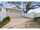 Attached garage with brick paver driveway at 1740 W Saint Louis St, Tampa, FL 33607