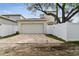 Attached garage with brick paver driveway at 1740 W Saint Louis St, Tampa, FL 33607