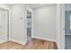 Bright hallway with hardwood floors and doors to bedrooms and bath at 1740 W Saint Louis St, Tampa, FL 33607