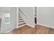 Upstairs hallway with hardwood floors and access to bedrooms at 1740 W Saint Louis St, Tampa, FL 33607