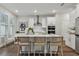 Modern kitchen with white cabinets and island seating at 1740 W Saint Louis St, Tampa, FL 33607