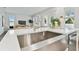 Kitchen island with farmhouse sink and a view into the living room at 1740 W Saint Louis St, Tampa, FL 33607