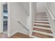 Modern staircase with wood treads and white risers at 1740 W Saint Louis St, Tampa, FL 33607