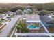 Aerial view of house, pool, and neighborhood at 17436 Lawn Orchid Loop, Land O Lakes, FL 34638