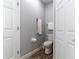 Small bathroom with toilet and linen storage at 17436 Lawn Orchid Loop, Land O Lakes, FL 34638