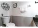 Clean and simple bathroom with dark granite vanity and updated toilet at 17436 Lawn Orchid Loop, Land O Lakes, FL 34638