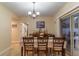 Formal dining room with table, chairs, and chandelier at 17436 Lawn Orchid Loop, Land O Lakes, FL 34638