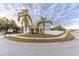 Two-story house with a landscaped yard and palm trees at 17436 Lawn Orchid Loop, Land O Lakes, FL 34638