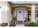 Welcoming front entry with a white door at 17436 Lawn Orchid Loop, Land O Lakes, FL 34638