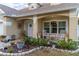 Relaxing front porch with rocking chairs at 17436 Lawn Orchid Loop, Land O Lakes, FL 34638