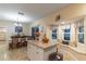 Open kitchen with an island and breakfast nook at 17436 Lawn Orchid Loop, Land O Lakes, FL 34638