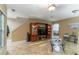 Spacious living room featuring a large TV and built-in shelving at 17436 Lawn Orchid Loop, Land O Lakes, FL 34638