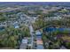 Aerial view of homes and pond in a community at 19144 Meadow Pine Dr, Tampa, FL 33647