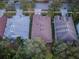 Aerial view of houses with brown roofs and green yards at 19144 Meadow Pine Dr, Tampa, FL 33647