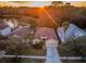 Aerial view of house near a lake with other homes at 19144 Meadow Pine Dr, Tampa, FL 33647