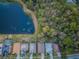 Aerial view of houses near a lake and trees at 19144 Meadow Pine Dr, Tampa, FL 33647