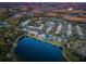 Aerial photo of homes near a lake at sunset at 19144 Meadow Pine Dr, Tampa, FL 33647