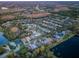 Aerial view of a community with houses, lakes, and lush green landscape at 19144 Meadow Pine Dr, Tampa, FL 33647