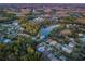 Aerial view of homes and pond in a residential area at 19144 Meadow Pine Dr, Tampa, FL 33647