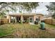 Spacious backyard with screened porch and a tranquil water feature at 19144 Meadow Pine Dr, Tampa, FL 33647