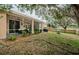 Screened patio, landscaping, and string lights enhance this backyard at 19144 Meadow Pine Dr, Tampa, FL 33647